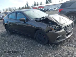 2016 Mazda Mazda3 i Sport with VIN JM1BM1T7XG1298654, listed as a IAAI auction lot 41946415 with 114,894 mi miles. Bid and sale history available at carsss.com. Image 1.