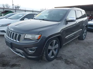 2014 Jeep Grand Cherokee Overland with VIN 1C4RJFCT8EC380899, listed as a IAAI auction lot 41372034 with 140,413 mi miles. Bid and sale history available at carsss.com. Image 18.
