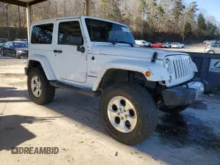 2014 Jeep Wrangler Sahara with VIN 1C4AJWBG1EL168007, listed as a Copart auction lot 87331394 with 113,228 mi miles and Salvage Title. Bid and sale history available at DreamBid. Image 4.