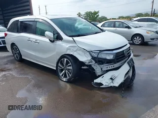 2023 Honda Odyssey Touring with VIN 5FNRL6H8XPB021977, listed as a IAAI auction lot 42120028 with 30,106 mi miles and . Bid and sale history available at DreamBid. Image 1.