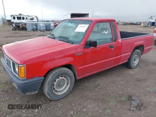 1994 Mitsubishi Mighty Max z VIN JA7LS21G0RP007773, wystawiony jako IAAI lot #41915117 z przebiegiem 68 410 mil mil oraz . Historia ofert i sprzedaży dostępna na DreamBid. Obrazek 2.