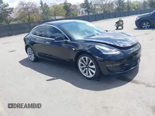 2018 Tesla Model 3 Long Range Battery with VIN 5YJ3E1EA3JF060296, listed as a IAAI auction lot 41901636 with 110,847 mi miles. Bid and sale history available at carsss.com. Image 1.
