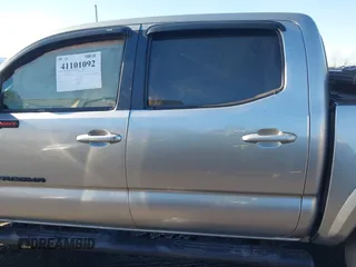 2023 Toyota Tacoma 4WD SR with VIN 3TMCZ5ANXPM543065, listed as a IAAI auction lot 41101092 with 33,792 mi miles. Bid and sale history available at carsss.com. Image 14.