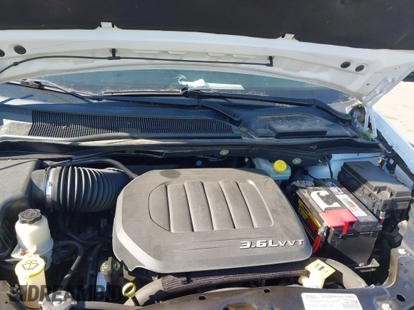 2015 Dodge Grand Caravan SE with VIN 2C4RDGBGXFR569435, listed as a IAAI auction lot 42057084 with 160,058 mi miles and . Bid and sale history available at DreamBid. Image 10.