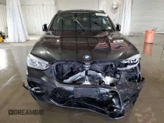 2020 BMW X4 M Competition z VIN 5YMUJ0C05L9B44115, wystawiony jako Copart lot #55556755 z przebiegiem Nie podano mil oraz Szkody całkowita. Historia ofert i sprzedaży dostępna na DreamBid. Obrazek 5.