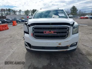 2015 GMC Yukon XL SLT with VIN 1GKS1HKC7FR126375, listed as a IAAI auction lot 41689017 with 218,622 mi miles. Bid and sale history available at carsss.com. Image 12.