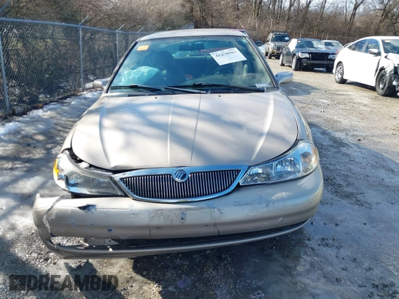 1999 Mercury Mystique GS z VIN 1MEFM6530XK635463, wystawiony jako IAAI lot #41478903 z przebiegiem 87 911 mil mil oraz . Historia ofert i sprzedaży dostępna na DreamBid. Obrazek 12.