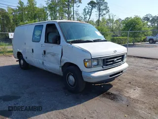 1999 Ford Econoline Cargo with VIN 1FTRE1420XHA34056, listed as a IAAI auction lot 41998411 with 236,267 mi miles. Bid and sale history available at carsss.com. Image 1.