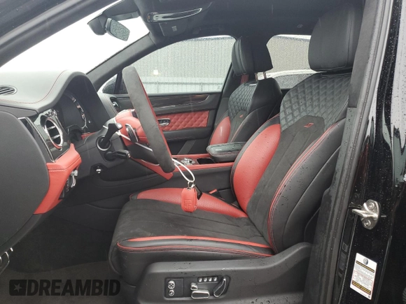 2022 Bentley Bentayga V8 z VIN SJAAM2ZV8NC039607, wystawiony jako Copart lot #54888564 z przebiegiem 15 561 mil mil oraz . Historia ofert i sprzedaży dostępna na DreamBid. Obrazek 7.