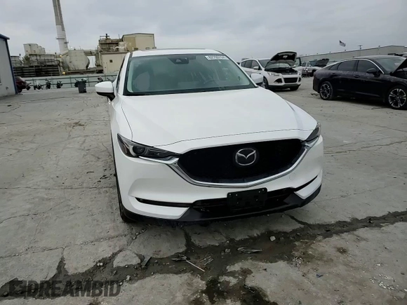 2021 Mazda CX-5 Grand Touring with VIN JM3KFBDM4M1344602, listed as a Copart auction lot 82793724 with 69,322 mi miles and Salvage Title. Bid and sale history available at carsss.com. Image 12.