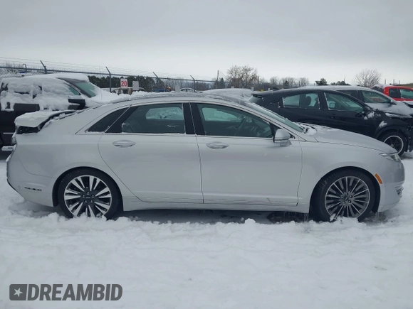 2014 Lincoln MKZ z VIN 3LN6L2JK9ER813109, wystawiony jako IAAI lot #41444866 z przebiegiem 128 613 mil mil oraz . Historia ofert i sprzedaży dostępna na DreamBid. Obrazek 14.