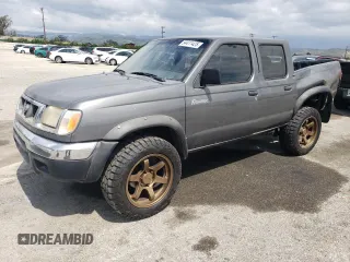 2000 Nissan Frontier XE with VIN 1N6ED27T5YC426456, listed as a Copart auction lot 54411425 with 117,600 mi miles and Salvage title. Bid and sale history available at DreamBid. Image 1.