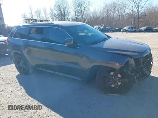2015 Jeep Grand Cherokee Overland z VIN 1C4RJFCGXFC215750, wystawiony jako IAAI lot #40795135 z przebiegiem 89 110 mil mil oraz . Historia ofert i sprzedaży dostępna na DreamBid. Obrazek 1.