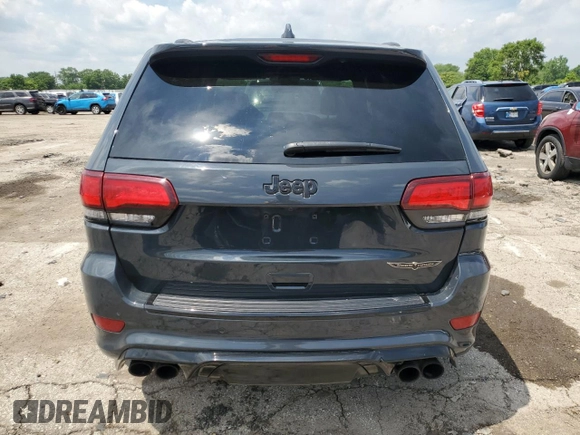 2018 Jeep Grand Cherokee Trackhawk with VIN 1C4RJFN99JC309254, listed as a Copart auction lot 64061615 with 104,558 mi miles and Clean title. Bid and sale history available at DreamBid. Image 6.