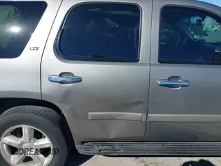 2007 Chevrolet Tahoe LTZ with VIN 1GNFC13J97R155705, listed as a IAAI auction lot 40914171 with 165,727 mi miles and . Bid and sale history available at DreamBid. Image 13.