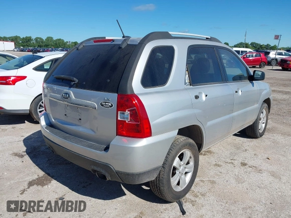 2009 Kia Sportage LX with VIN KNDJF724X97556574, listed as a IAAI auction lot 42206080 with 115,868 mi miles and . Bid and sale history available at carsss.com. Image 4.