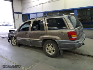 2001 Jeep Grand Cherokee Laredo with VIN 1J4GW48N01C529690, listed as a Copart auction lot 82037774 with 142,673 mi miles and Salvage Title. Bid and sale history available at carsss.com. Image 2.