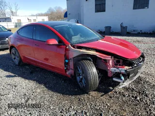 2022 Tesla Model 3 with VIN 5YJ3E1EA5NF184785, listed as a Copart auction lot 49466575 with 85,273 mi miles and Salvage Title. Bid and sale history available at DreamBid. Image 4.