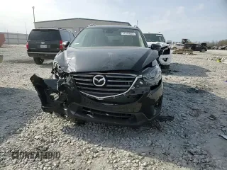 2016 Mazda CX-5 Touring z VIN JM3KE4CY0G0667171, wystawiony jako Copart lot #51579005 z przebiegiem 39 487 mil mil oraz Szkoda całkowita • Salvage title. Historia ofert i sprzedaży dostępna na DreamBid. Obrazek 12.