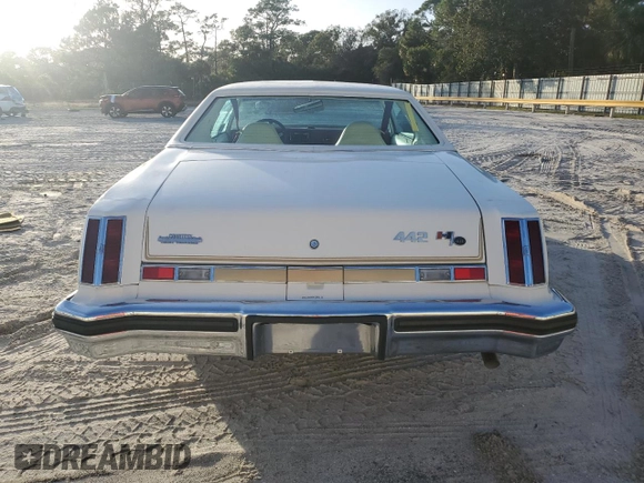 1975 Oldsmobile Cutlass z VIN 3J57T5M323248, wystawiony jako Copart lot #80526124 z przebiegiem 13 934 mil mil oraz Szkody całkowita. Historia ofert i sprzedaży dostępna na DreamBid. Obrazek 6.