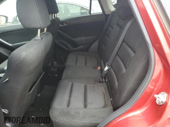 2014 Mazda CX-5 Touring z VIN JM3KE4CY3E0382106, wystawiony jako Copart lot #55521645 z przebiegiem 84 539 mil mil oraz Szkoda całkowita • Salvage title. Historia ofert i sprzedaży dostępna na DreamBid. Obrazek 11.