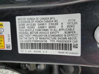 2024 Honda Civic Touring z VIN 2HGFE1F96RH324748, wystawiony jako Copart lot #58833725 z przebiegiem Nie podano mil oraz Szkoda całkowita • Salvage title. Historia ofert i sprzedaży dostępna na DreamBid. Obrazek 12.