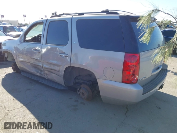 2007 GMC Yukon SLE with VIN 1GKFK130X7J131757, listed as a IAAI auction lot 41237779 with 156,148 mi miles. Bid and sale history available at carsss.com. Image 3.