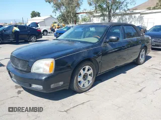 2002 Cadillac DeVille DTS z VIN 1G6KF579X2U134554, wystawiony jako IAAI lot #42244304 z przebiegiem 149 141 mil mil oraz . Historia ofert i sprzedaży dostępna na DreamBid. Obrazek 2.