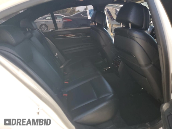 2013 BMW 7 Series 750i with VIN WBAYA8C54DC996412, listed as a Copart auction lot 56982895 with 124,258 mi miles and Salvage title. Bid and sale history available at DreamBid. Image 10.