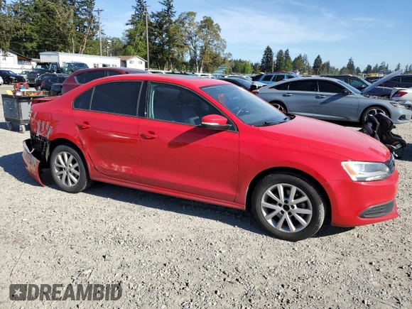 2012 Volkswagen Jetta SE with VIN 3VWDP7AJXCM411045, listed as a Copart auction lot 55111105 with 99,219 mi miles and Salvage title. Bid and sale history available at DreamBid. Image 4.