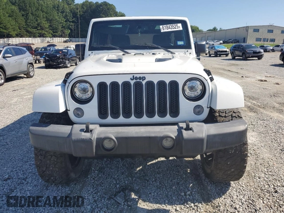2015 Jeep Wrangler Unlimited Sahara with VIN 1C4BJWEG3FL584920, listed as a Copart auction lot 61843525 with 62,876 mi miles and Salvage title. Bid and sale history available at DreamBid. Image 5.