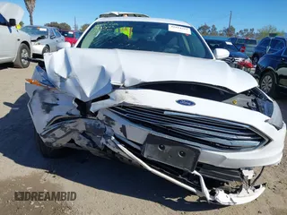 2018 Ford Fusion SE z VIN 3FA6P0LU3JR102971, wystawiony jako IAAI lot #41814321 z przebiegiem 135 472 mil mil oraz . Historia ofert i sprzedaży dostępna na DreamBid. Obrazek 6.