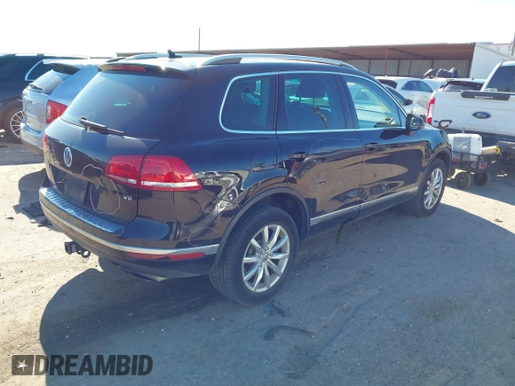 2016 Volkswagen Touareg Sport with VIN WVGEF9BP4GD012265, listed as a IAAI auction lot 41208383 with 69,205 mi miles and . Bid and sale history available at DreamBid. Image 4.