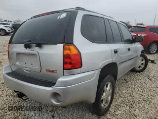 2009 GMC Envoy SLE with VIN 1GKDS33S492129469, listed as a Copart auction lot 83232024 with 131,735 mi miles and Salvage Title. Bid and sale history available at carsss.com. Image 3.