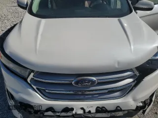 2015 Ford Edge Titanium z VIN 2FMTK4K84FBB64176, wystawiony jako Copart lot #57729005 z przebiegiem 50 654 mil mil oraz Szkoda całkowita • Salvage title. Historia ofert i sprzedaży dostępna na DreamBid. Obrazek 11.