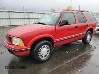 1998 GMC Jimmy SLE with VIN 1GKDT13W1W2508350, listed as a Copart auction lot 77904394 with 175,000 mi miles and Salvage Title. Bid and sale history available at carsss.com. Image 1.