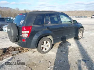 2010 Suzuki Grand Vitara with VIN JS3TE0D4XA4100453, listed as a IAAI auction lot 41603012 with 210,039 mi miles and . Bid and sale history available at DreamBid. Image 4.