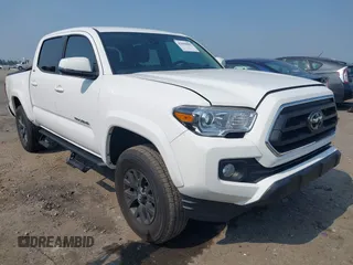 2023 Toyota Tacoma SR with VIN 3TMCZ5AN4PM648409, listed as a IAAI auction lot 42590900 with 19,805 mi miles and . Bid and sale history available at DreamBid. Image 1.