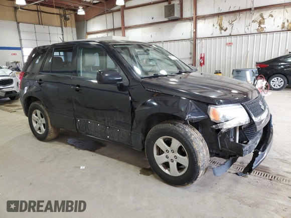 2012 Suzuki Grand Vitara Premium z VIN JS3TD0D66C4100814, wystawiony jako Copart lot #89250025 z przebiegiem 102 381 mil mil oraz Szkody całkowita. Historia ofert i sprzedaży dostępna na DreamBid. Obrazek 4.