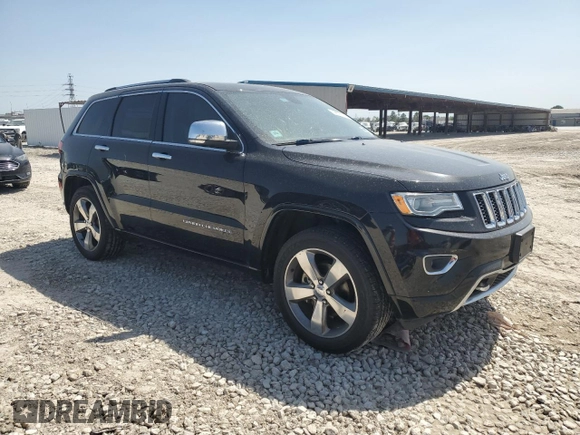 2015 Jeep Grand Cherokee High Altitude with VIN 1C4RJECGXFC906464, listed as a Copart auction lot 49657955 with 125,239 mi miles and Salvage Title. Bid and sale history available at carsss.com. Image 4.
