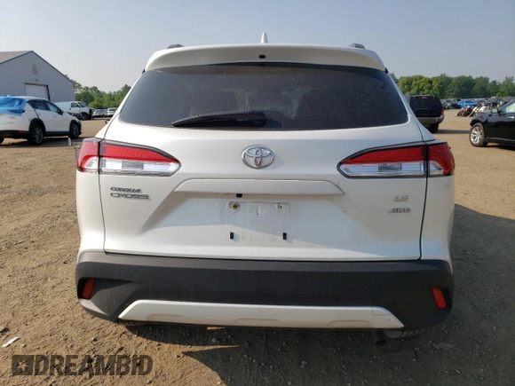 2023 Toyota Corolla Cross LE with VIN 7MUCAABG3PV060880, listed as a Copart auction lot 59664915 with 18,246 mi miles and Salvage title. Bid and sale history available at DreamBid. Image 6.