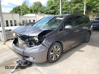 2015 Honda Odyssey Touring Elite with VIN 5FNRL5H97FB018892, listed as a Copart auction lot 64587185 with Not provided miles and Salvage title. Bid and sale history available at DreamBid. Image 1.