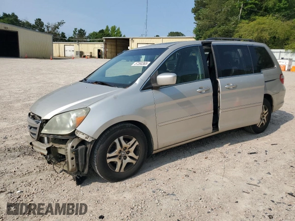 2006 Honda Odyssey EX-L with VIN 5FNRL38706B037805, listed as a Copart auction lot 57390365 with 219,554 mi miles and Salvage title. Bid and sale history available at DreamBid. Image 1.