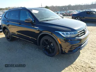 2022 Volkswagen Tiguan SE R-Line Black with VIN 3VVCB7AX1NM084993, listed as a IAAI auction lot 41502738 with 56,559 mi miles and . Bid and sale history available at DreamBid. Image 1.