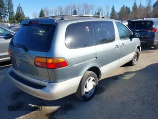1999 Toyota Sienna LE with VIN 4T3ZF13C3XU103436, listed as a IAAI auction lot 41667242 with 228,318 mi miles. Bid and sale history available at carsss.com. Image 4.