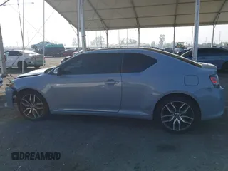 2014 Scion tC with VIN JTKJF5C7XE3079765, listed as a IAAI auction lot 41210220 with 114,410 mi miles. Bid and sale history available at carsss.com. Image 14.