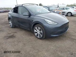 2021 Tesla Model Y Long Range z VIN 5YJYGDEE0MF259783, wystawiony jako IAAI lot #41884148 z przebiegiem 66 445 mil mil oraz . Historia ofert i sprzedaży dostępna na DreamBid. Obrazek 1.