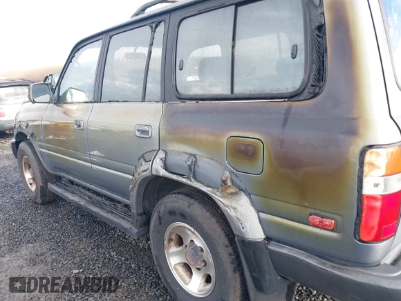 1995 Toyota Land Cruiser z VIN JT3DJ81W0S0094999, wystawiony jako IAAI lot #41583748 z przebiegiem 93 454 mil mil oraz . Historia ofert i sprzedaży dostępna na DreamBid. Obrazek 12.