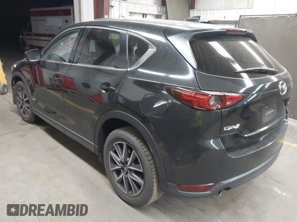 2018 Mazda CX-5 Grand Touring z VIN JM3KFADMXJ0311101, wystawiony jako IAAI lot #42163070 z przebiegiem 129 284 mil mil oraz . Historia ofert i sprzedaży dostępna na DreamBid. Obrazek 3.