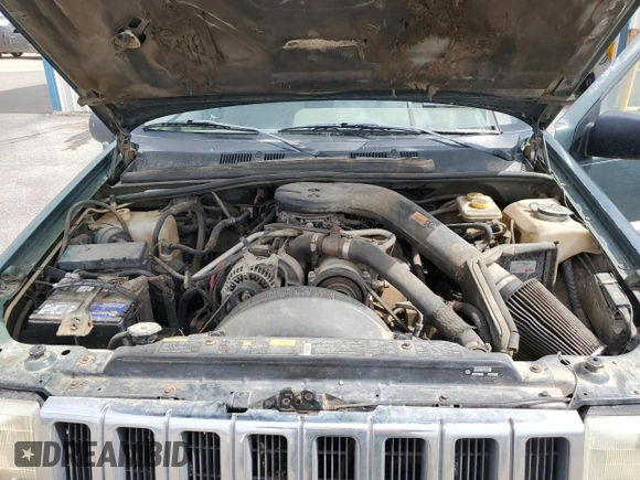 1993 Jeep Grand Cherokee Laredo with VIN 1J4GZ58Y8PC513026, listed as a Copart auction lot 57001465 with 135,242 mi miles and Clean title. Bid and sale history available at DreamBid. Image 12.
